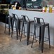 Tabourets hauts en acier gris métal avec dossier Bolero Bistro (lot de 4)